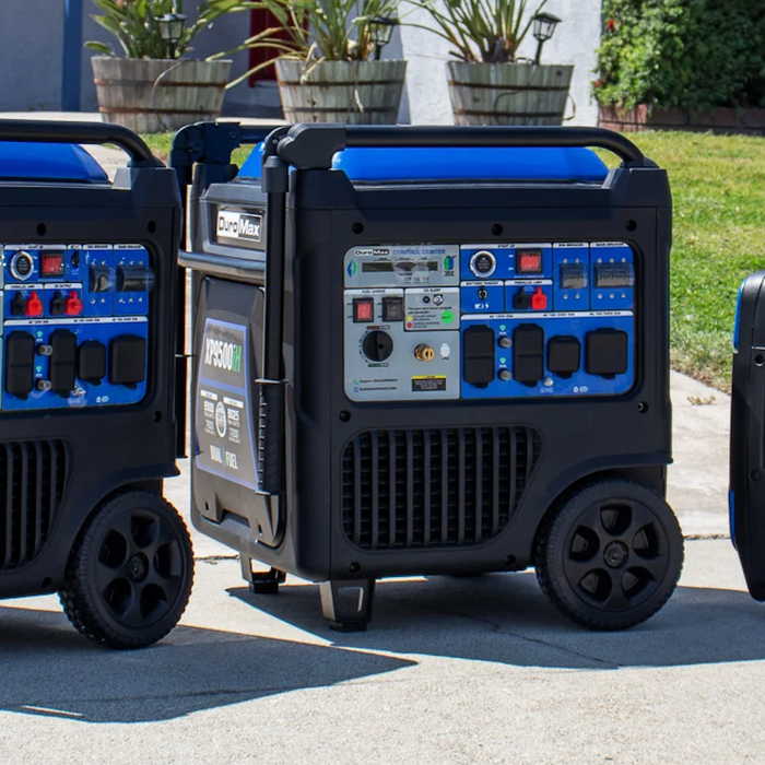 Portable home backup generators in different wattage sizes displayed on a residential driveway for generator size comparison