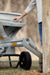 MudMixer Evolution with Chute Extension pouring concrete at a fence post
