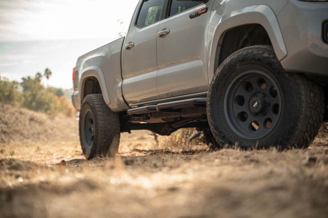 DV8 Offroad 2016-2023 Toyota Tacoma Crew Cab OE Plus Side Steps – on the trail, image 2 of 12