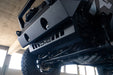 DV8 Offroad 2018-2026 Jeep JL & JT Sway Bar Disconnect Skid Plate – installed on vehicle, image 9 of 20