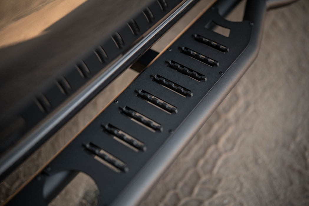 DV8 2019-2026 GMC Sierra 1500 & Chevrolet Silverado 1500 Crew Cab OE Plus Side Steps – installed on vehicle, image 16 of 19