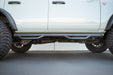 DV8 Offroad 2021-2026 Ford Bronco Trailing Arm Skid Plates With OEM Skid – installed on vehicle, image 5 of 11