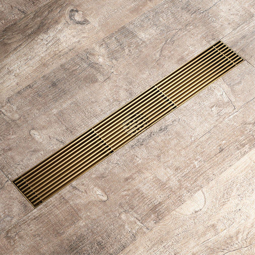 Brushed gold Linear shower drain stainless steel material 35.4 inch with grid cover with hair strainer and adjustment feet - angle view