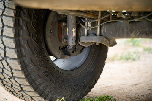 DV8 Offroad 2016-2023 Toyota Tacoma Rear Shock Skid Plates – installed on vehicle, image 2 of 12