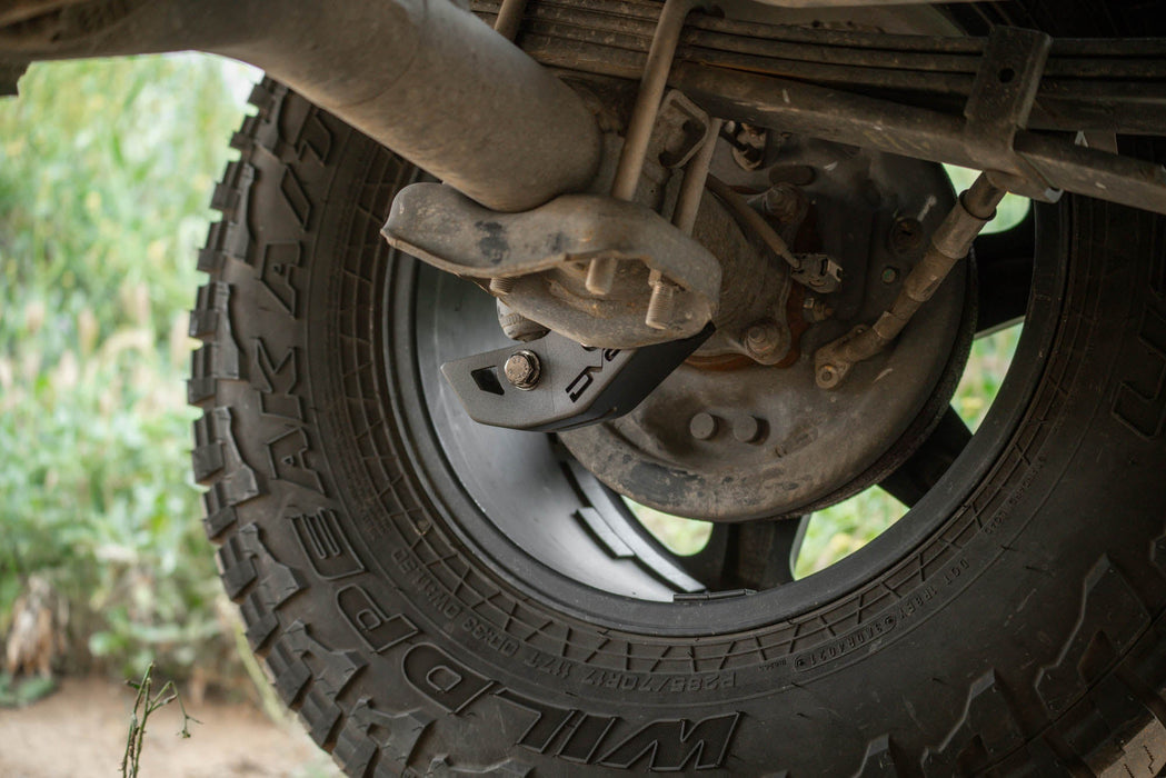DV8 Offroad 2016-2023 Toyota Tacoma Rear Shock Skid Plates – installed on vehicle, image 6 of 12