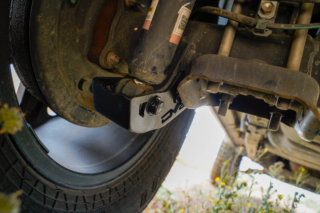 DV8 Offroad 2016-2023 Toyota Tacoma Rear Shock Skid Plates – installed on vehicle, image 9 of 12
