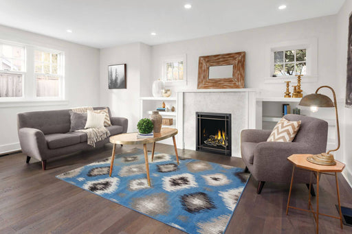 Napoleon Altitude X 36 propane direct vent fireplace with driftwood logs in a living room