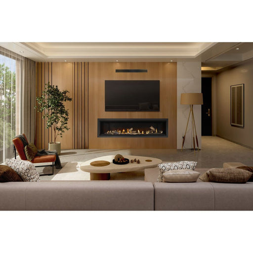 Napoleon Ascent Linear Premium 76 natural gas linear fireplace with driftwood logs, Shore Fire media and finishing trim in a living room