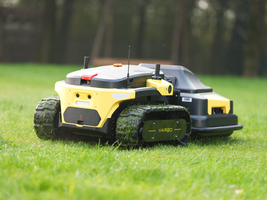 Autonomous mower handling steep grassy slope with precision control