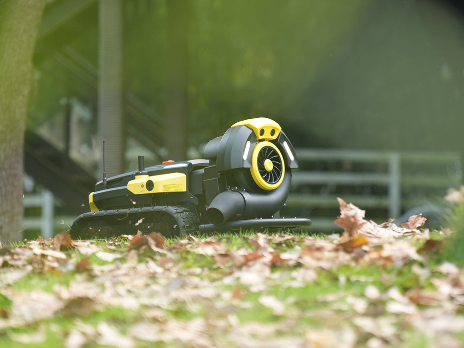 High-powered airflow clearing leaves across driveway and outdoor surfaces
