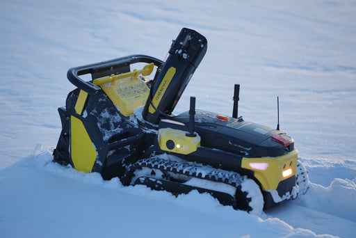 Yarbo snow blower robot clearing snow from residential driveway