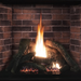 Empire Traditional Charred log set burning in a Tahoe Clean-Face Premium fireplace