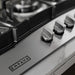 Close-up of the metal control knobs and Empava logo on the EMPV-30GC21-GX gas cooktop