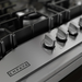 Close-up of the metal control knobs on the Empava EMPV-30GC5B70C-GX gas cooktop