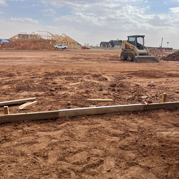 Concrete forms set on a large residential construction site
