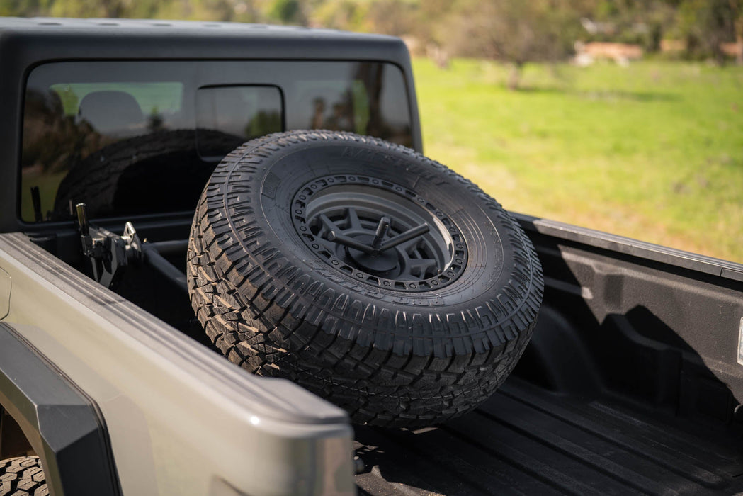 DV8 Offroad 2020-2025 Jeep Gladiator JT Adjustable In-Bed Spare Tire Carrier – on the trail, image 2 of 18