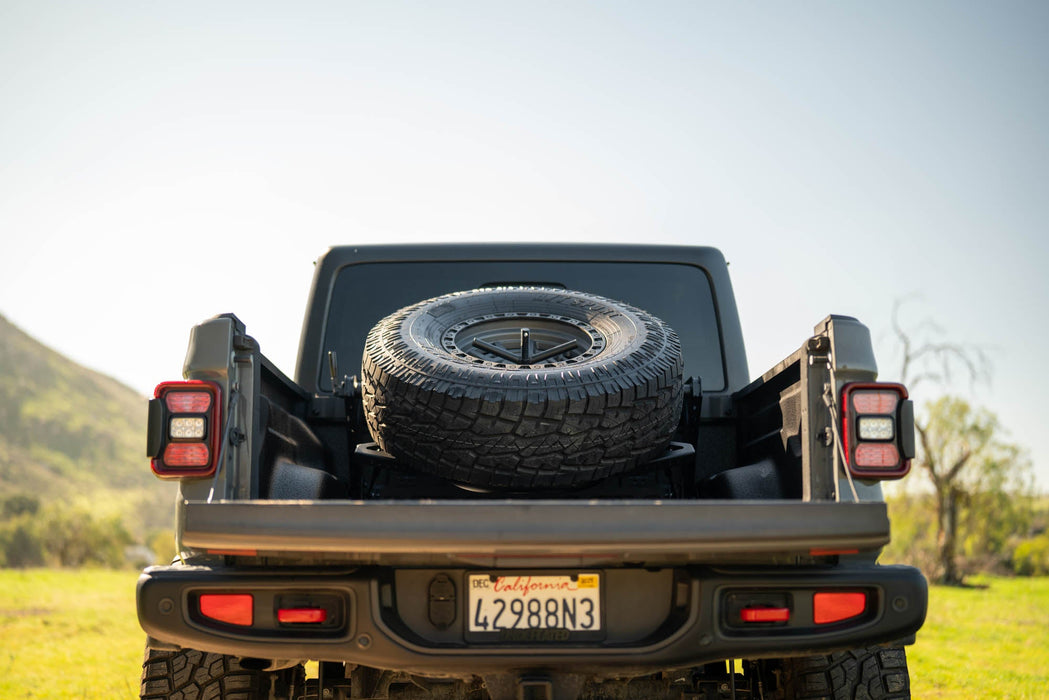 DV8 Offroad 2020-2025 Jeep Gladiator JT Adjustable In-Bed Spare Tire Carrier – on the trail, image 7 of 18