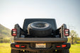 DV8 Offroad 2020-2025 Jeep Gladiator JT Adjustable In-Bed Spare Tire Carrier – on the trail, image 7 of 18