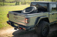 DV8 Offroad 2020-2025 Jeep Gladiator JT Adjustable In-Bed Spare Tire Carrier – on the trail, image 4 of 18
