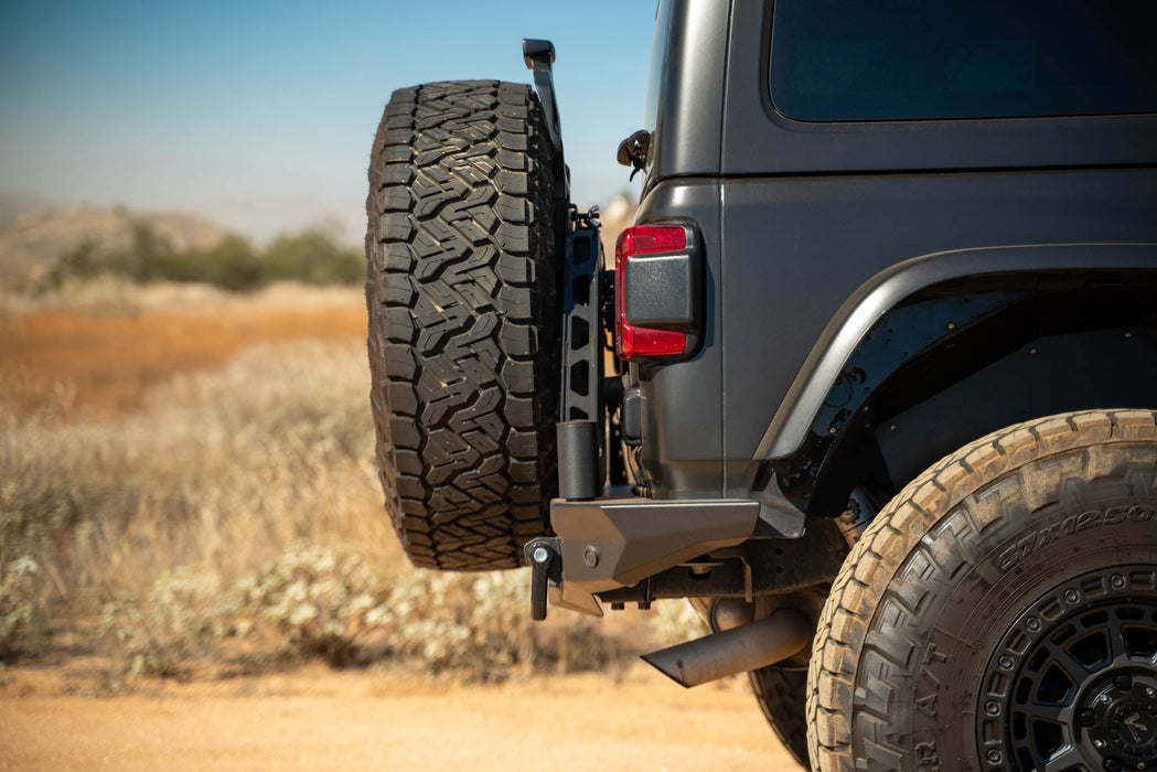 DV8 Offroad 2018-2026 Jeep Wrangler JL MTO Series Bumper Spare Tire Swing Gate – installed on vehicle, image 3 of 17