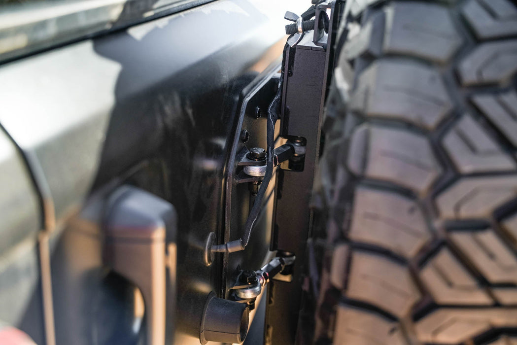 DV8 Offroad 2018-2026 Jeep Wrangler JL MTO Series Bumper Spare Tire Swing Gate – installed on vehicle, image 7 of 17