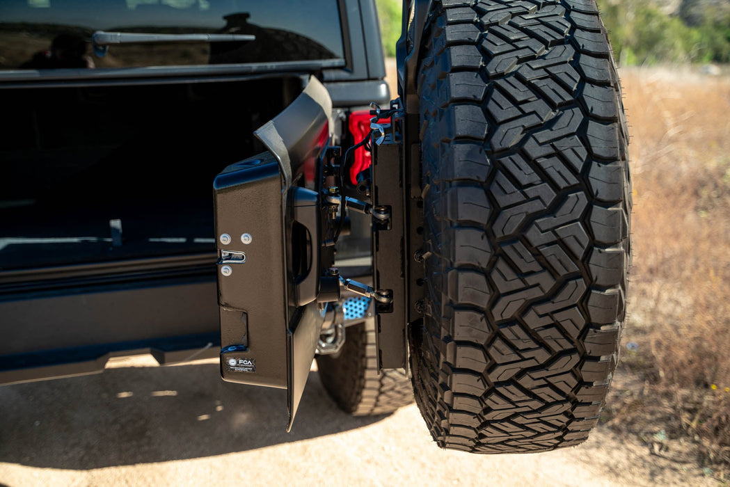 DV8 Offroad 2018-2026 Jeep Wrangler JL MTO Series Bumper Spare Tire Swing Gate – installed on vehicle, image 4 of 17