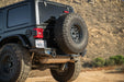 DV8 Offroad 2018-2026 Jeep Wrangler JL MTO Series Bumper Spare Tire Swing Gate – installed on vehicle, image 10 of 17