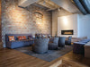 Napoleon Luxuria 50 single-sided natural gas linear fireplace in a lounge with nickel sticks media