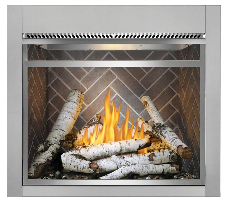 Napoleon Riverside 36 clean face outdoor natural gas fireplace with birch logs and herringbone panels