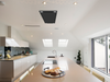 Matte black Victory Sunset ceiling range hood mounted in kitchen