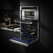 Thor Kitchen TMW30ED microwave wall oven combo shown in ambient kitchen lighting