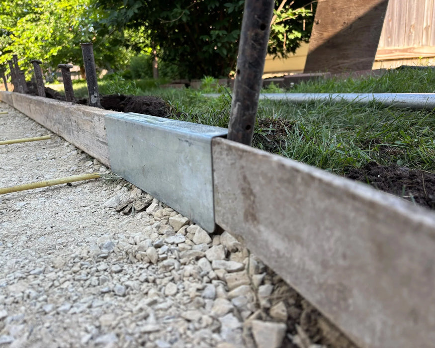 FormExtender connecting form boards along a gravel walkway