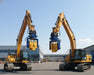 RAMEX auto-tilting vibro hammer, two units on excavators at the factory yard