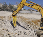 RAMEX RAM hydraulic breaker breaking rock on a large excavator, representative photo