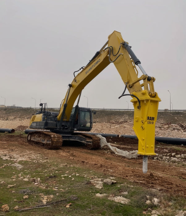 RAMEX RAM hydraulic breaker on a large excavator at a quarry, representative photo