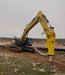 RAMEX RAM hydraulic breaker on a large excavator at a quarry, representative photo