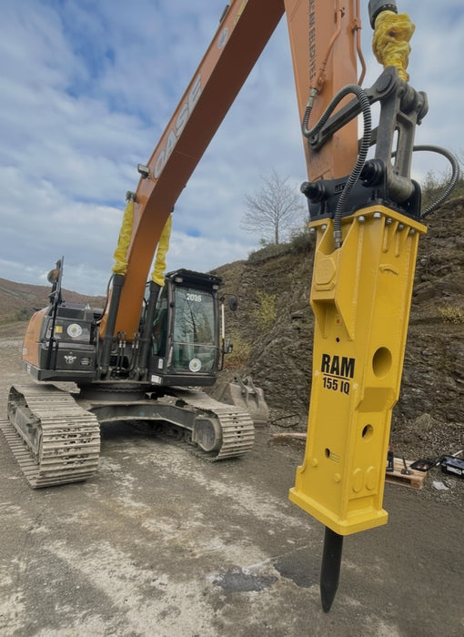 RAMEX RAM hydraulic breaker working on a rocky slope, representative photo