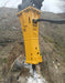 RAMEX RAM hydraulic breaker close-up breaking rock on site, representative photo