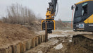 RAMEX side-grip vibro hammer installing sheet piles along an excavation