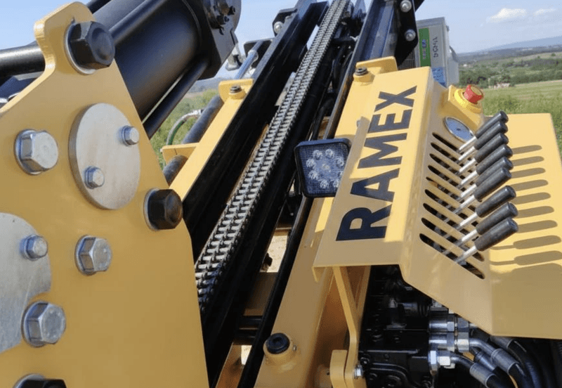 RAMEX SPD solar pile driver, close-up of the hammer mast and branding