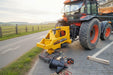 RAMEX Stumpbuster stump grinder on a tractor beside a row of stumps